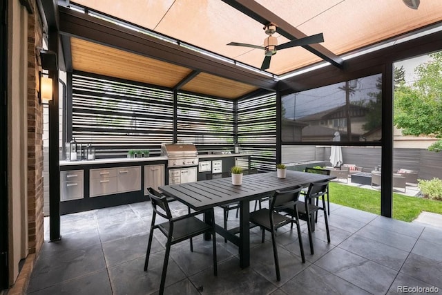 sunroom with exterior kitchen, outdoor dining space, and ceiling fan