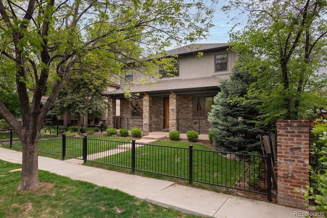 1927 S Grant St, Denver, CO 80210 - view of front of property featuring a fenced front yard, brick siding, and roof with shingles
