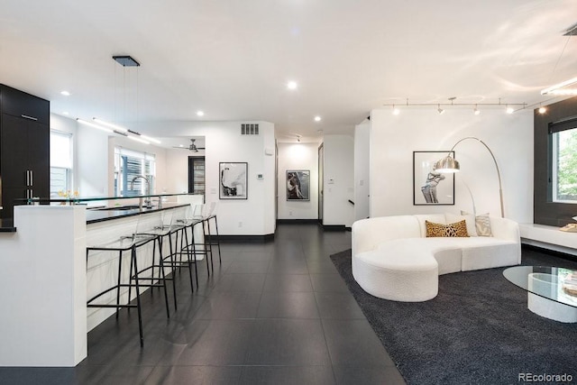 1927 S Grant St, Denver, CO 80210 - living area featuring recessed lighting and dark tile patterned floors