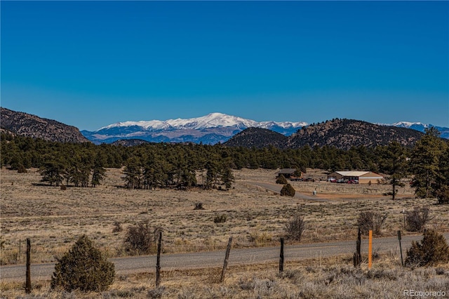 view of mountain feature with a rural view