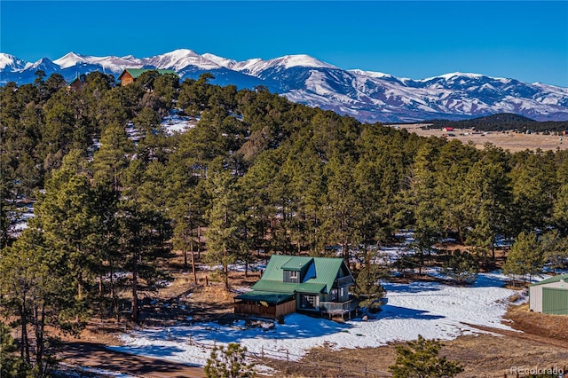 mountain view featuring a forest view