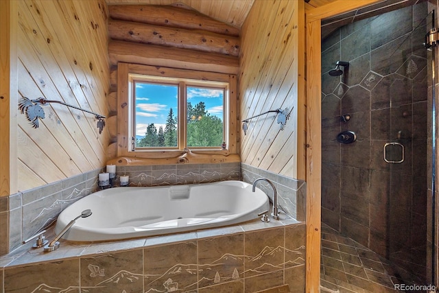 full bath featuring a garden tub and a shower stall