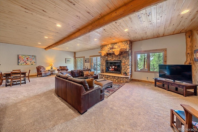 living area with carpet floors, wood ceiling, beamed ceiling, and a stone fireplace