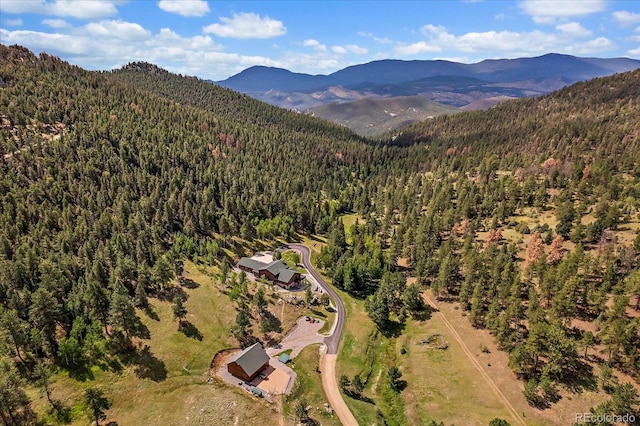 bird's eye view with a mountain view and a view of trees