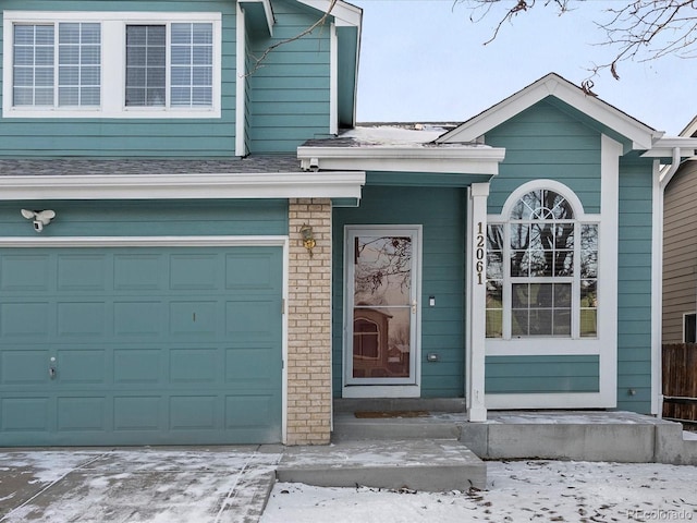 entrance to property featuring a garage