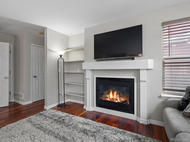 living room with dark wood-type flooring