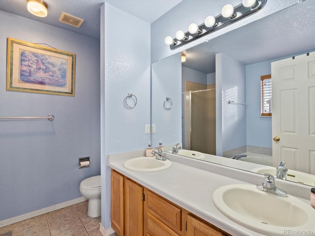 full bathroom featuring tile patterned flooring, plus walk in shower, vanity, and toilet