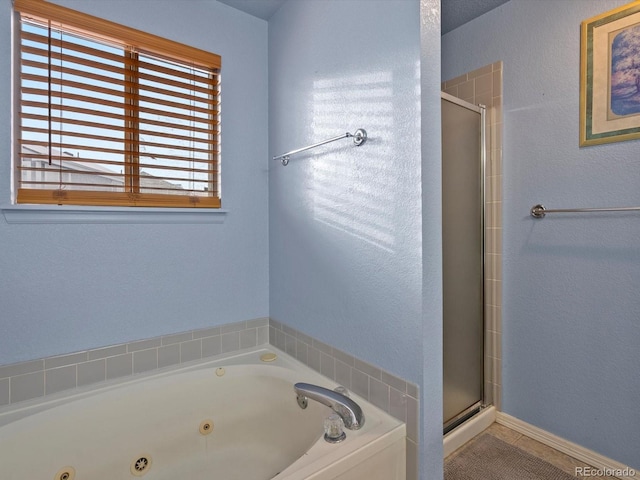 bathroom with separate shower and tub