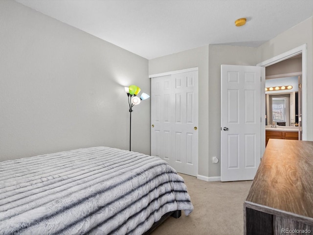 bedroom featuring light carpet and a closet