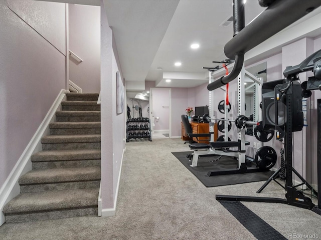 exercise area featuring light carpet