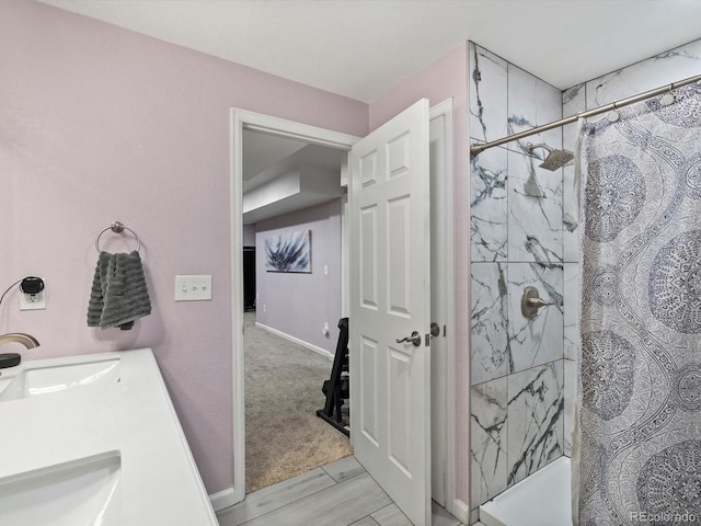 bathroom featuring vanity, wood-type flooring, and curtained shower