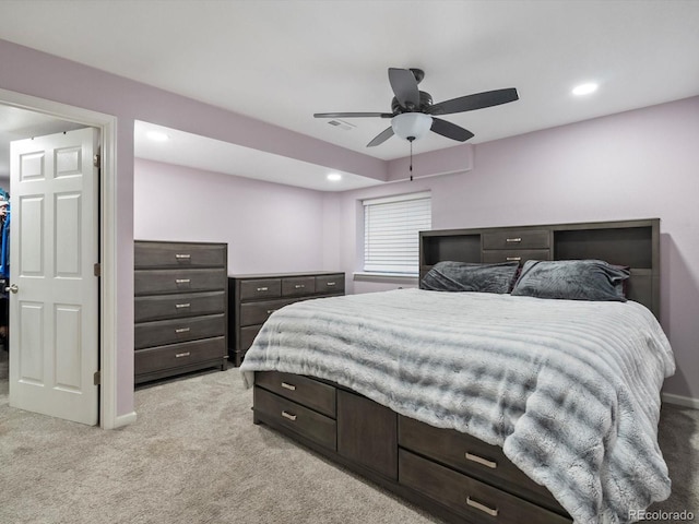 bedroom featuring ceiling fan and light carpet