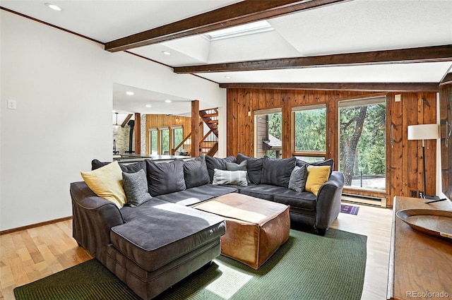7221 S Brook Forest Rd, Evergreen, CO 80439 - living area with a baseboard heating unit, beam ceiling, wooden walls, light wood finished floors, and recessed lighting