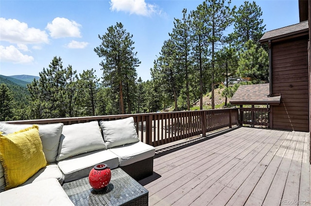 7221 S Brook Forest Rd, Evergreen, CO 80439 - wooden deck with an outdoor living space