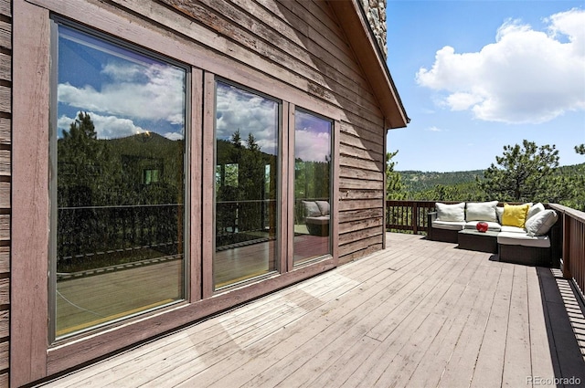 7221 S Brook Forest Rd, Evergreen, CO 80439 - wooden deck with outdoor lounge area