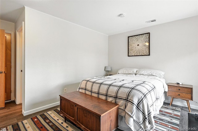 7221 S Brook Forest Rd, Evergreen, CO 80439 - bedroom featuring wood finished floors and ornamental molding