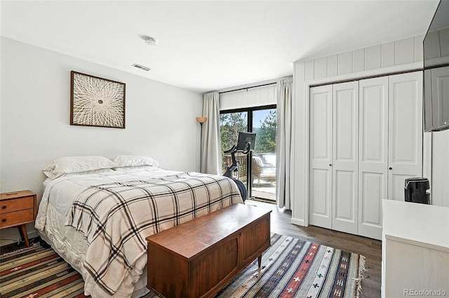 7221 S Brook Forest Rd, Evergreen, CO 80439 - bedroom with access to exterior, wood finished floors, and a closet