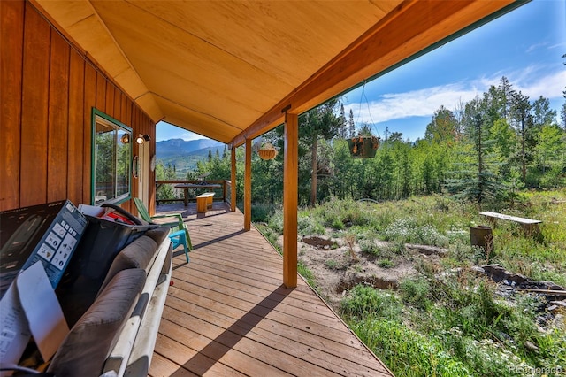 wooden deck with a mountain view