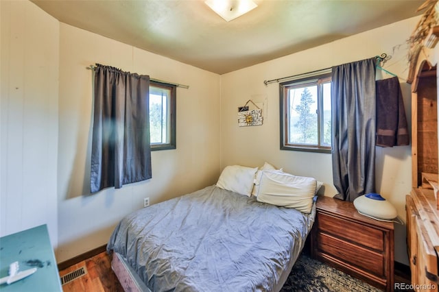 bedroom featuring dark hardwood / wood-style floors