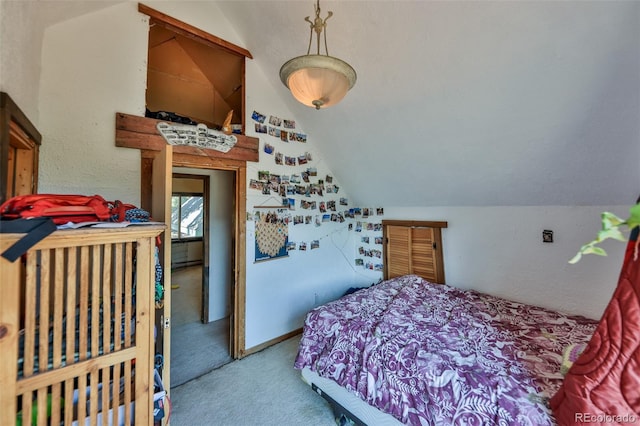 bedroom featuring carpet flooring and vaulted ceiling