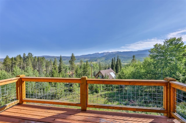 wooden deck featuring a mountain view