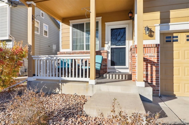 doorway to property featuring a porch