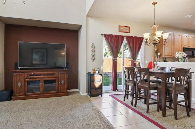 14389 E 101st Pl, Commerce City, CO 80022 - dining area with a chandelier, light tile patterned floors, and baseboards