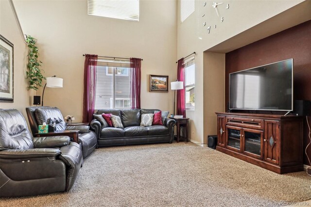 14389 E 101st Pl, Commerce City, CO 80022 - living room featuring carpet floors and a towering ceiling