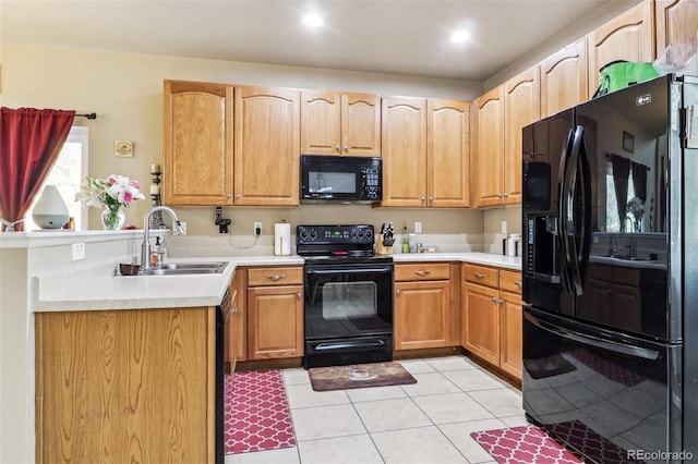 14389 E 101st Pl, Commerce City, CO 80022 - kitchen featuring black appliances, a sink, light tile patterned flooring, a peninsula, and light countertops