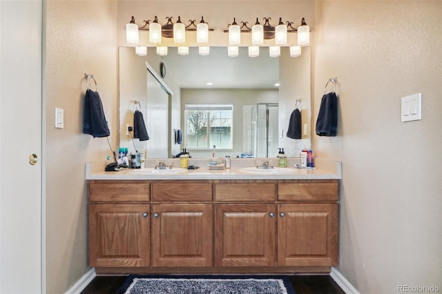 bathroom with vanity and an enclosed shower