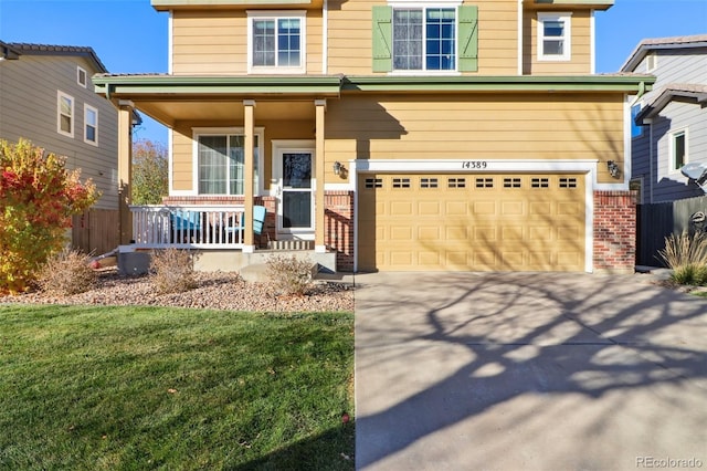 14389 E 101st Pl, Commerce City, CO 80022 - view of front of house with a porch, driveway, brick siding, a garage, and a front lawn