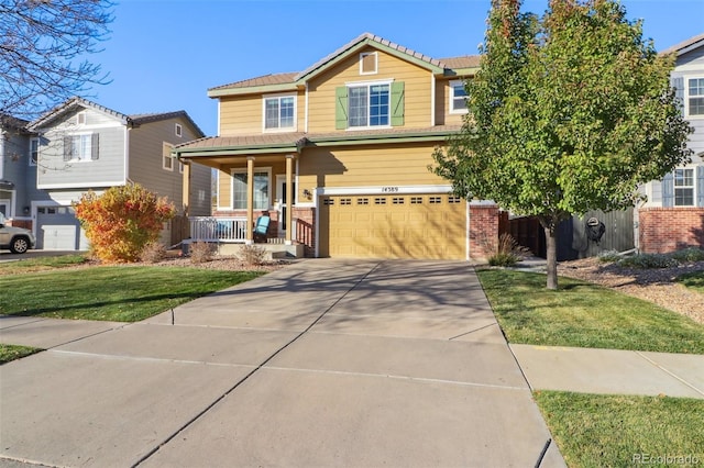 14389 E 101st Pl, Commerce City, CO 80022 - view of front of house with covered porch, brick siding, a garage, and concrete driveway