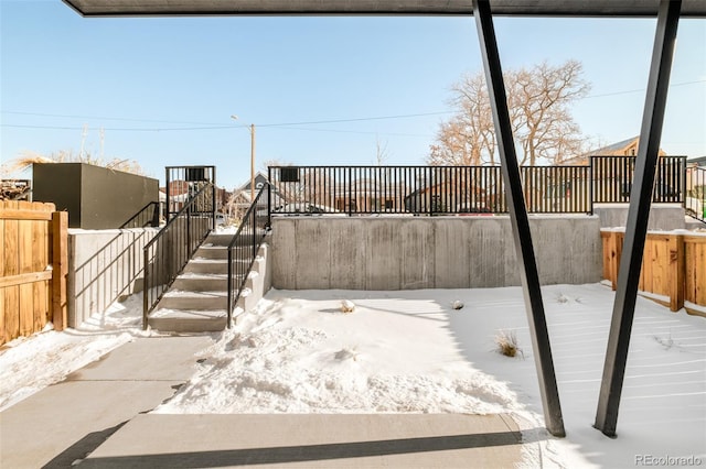 view of snow covered patio