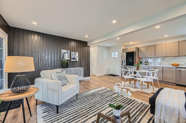 1040 Grove St, Denver, CO 80204 - living area featuring baseboards, wood walls, light wood-type flooring, and recessed lighting