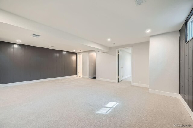 1040 Grove St, Denver, CO 80204 - finished basement featuring wooden walls, light colored carpet, baseboards, visible vents, and recessed lighting