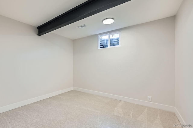 1040 Grove St, Denver, CO 80204 - below grade area featuring baseboards, visible vents, and light colored carpet