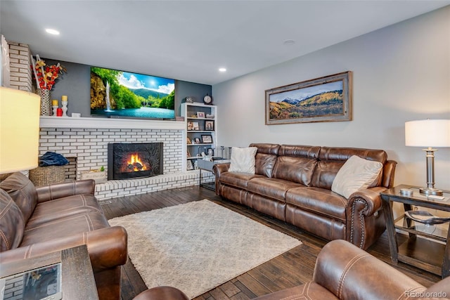 living room featuring hardwood / wood-style flooring and a fireplace