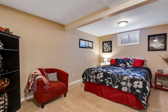 carpeted bedroom featuring a textured ceiling