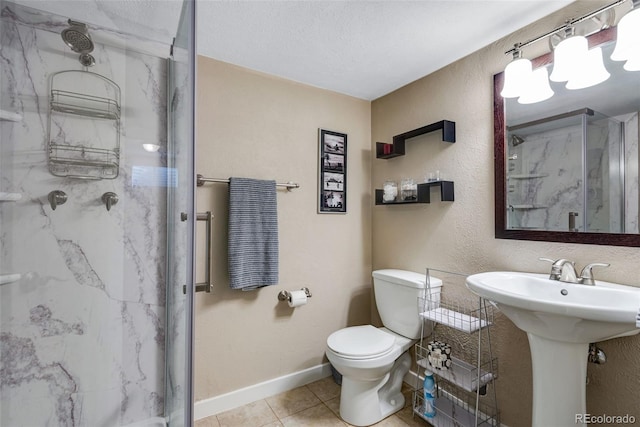 bathroom featuring toilet, tile patterned flooring, and a shower with shower door