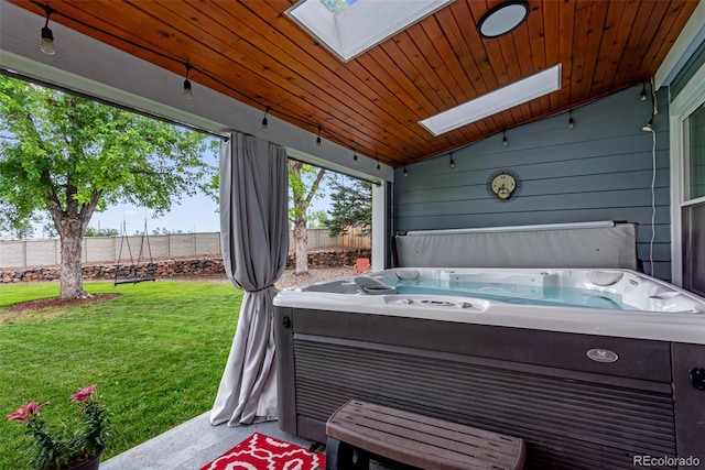 exterior space with lofted ceiling, a hot tub, and wooden ceiling