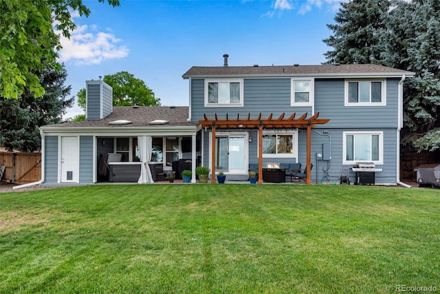 back of property featuring a patio area, a yard, and a pergola