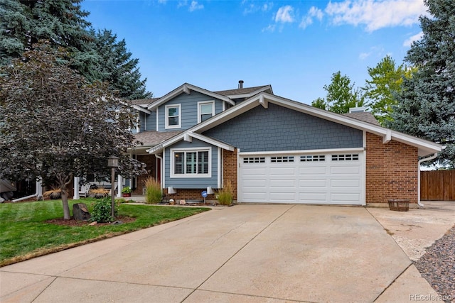 view of front of property featuring a front yard and a garage