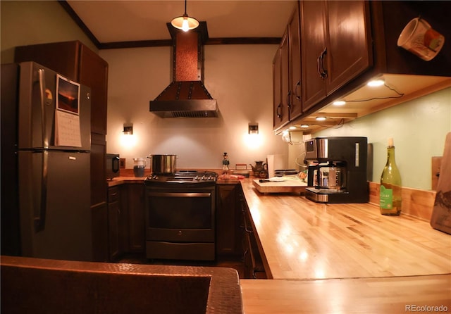 kitchen featuring stainless steel appliances, wood counters, ornamental molding, extractor fan, and hardwood / wood-style flooring