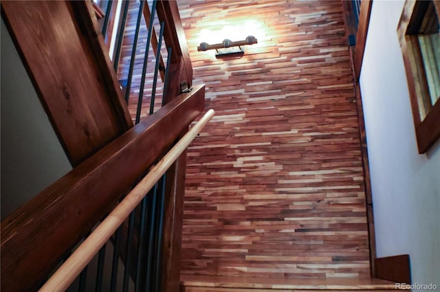 stairs with hardwood / wood-style flooring