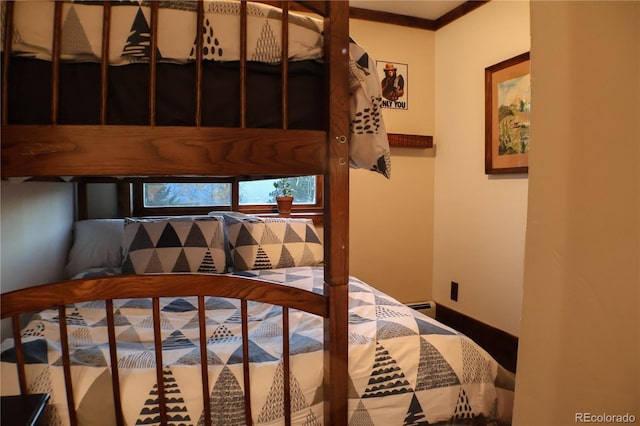 bedroom with crown molding