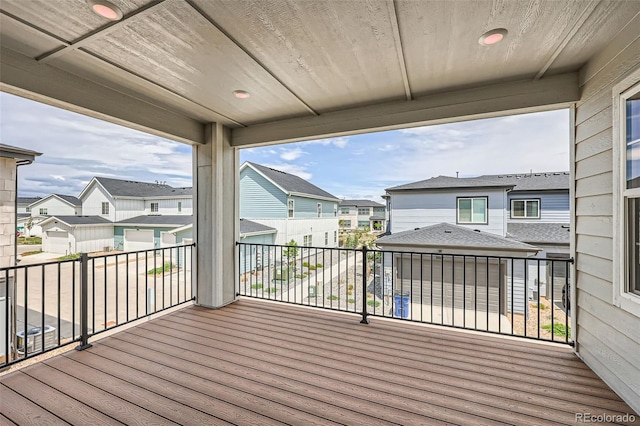 wooden deck featuring a residential view