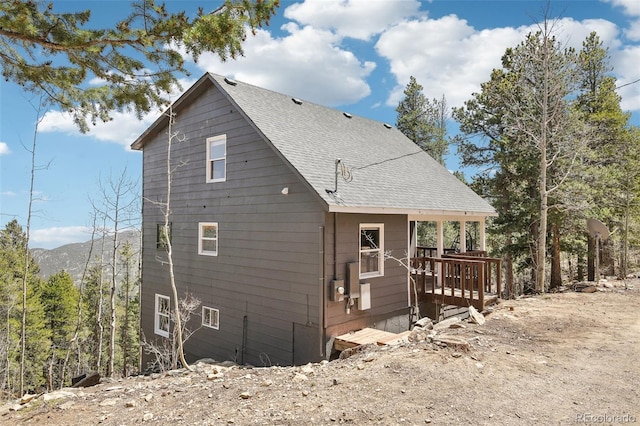 11390 Shimley Rd, Golden, CO 80403 - view of side of property featuring a shingled roof