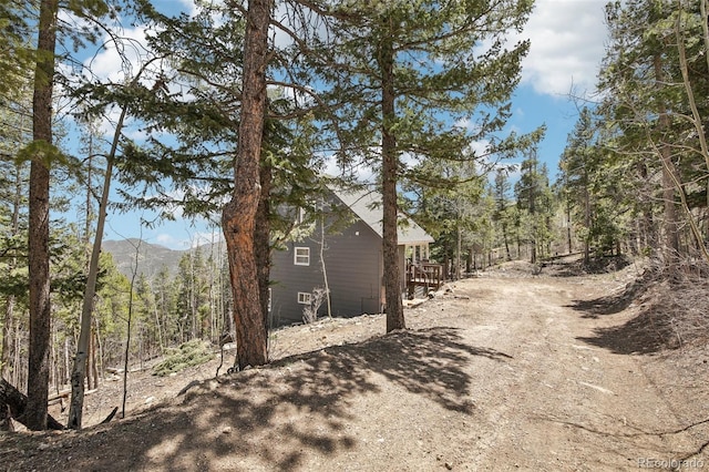 11390 Shimley Rd, Golden, CO 80403 - view of property exterior with a wooded view and a mountain view