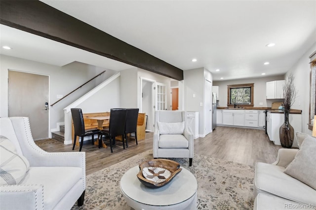 11390 Shimley Rd, Golden, CO 80403 - living area with light wood-style flooring, stairway, recessed lighting, and baseboards