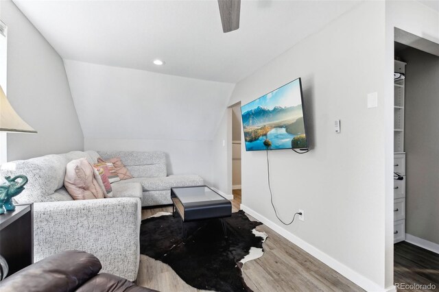 11390 Shimley Rd, Golden, CO 80403 - living area with wood finished floors, baseboards, ceiling fan, and vaulted ceiling